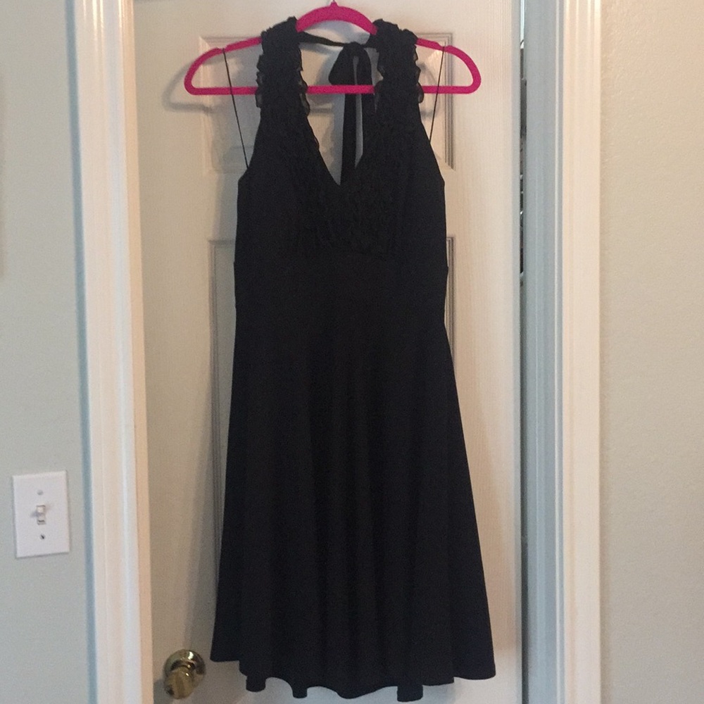 Black halter dress with ruffled neckline